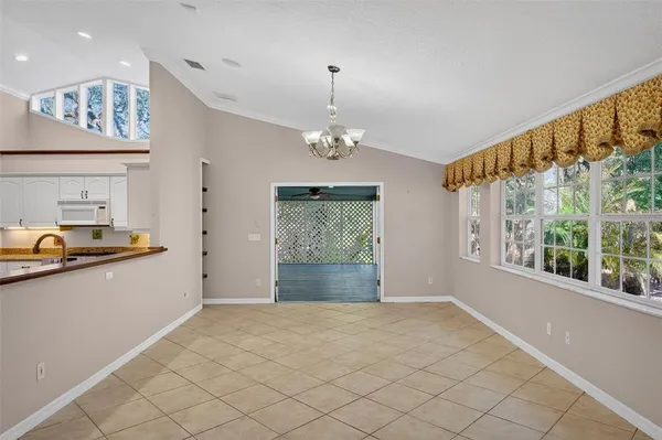a kitchen with stainless steel appliances kitchen island granite countertop a stove a sink and a microwave