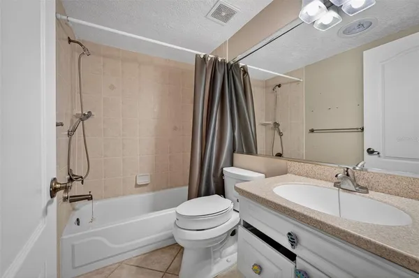 a bathroom that has a glass shower door