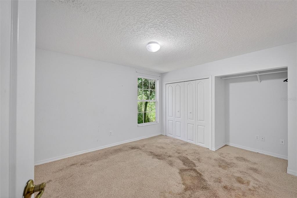 4875 Sailfish Drive Ponce Inlet, FL 32127 - Photo 23 of 60 a view of an empty room and window