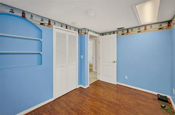 a view of an entryway with wooden floor