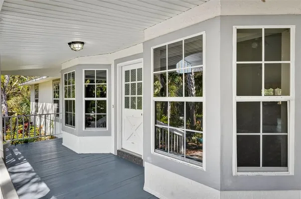 a view of an entryway with wooden floor and windows