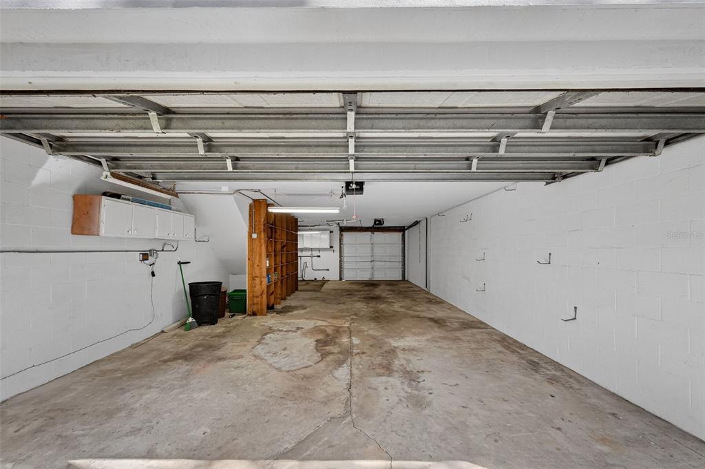 4875 Sailfish Drive Ponce Inlet, FL 32127 - Photo 34 of 60 a view of storage and utility room with racks on the wall