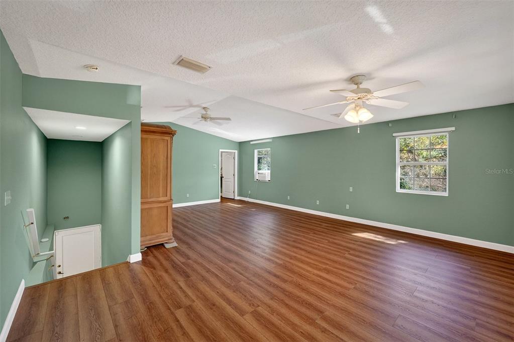4875 Sailfish Drive Ponce Inlet, FL 32127 - Photo 37 of 60 a view of a livingroom with a chandelier