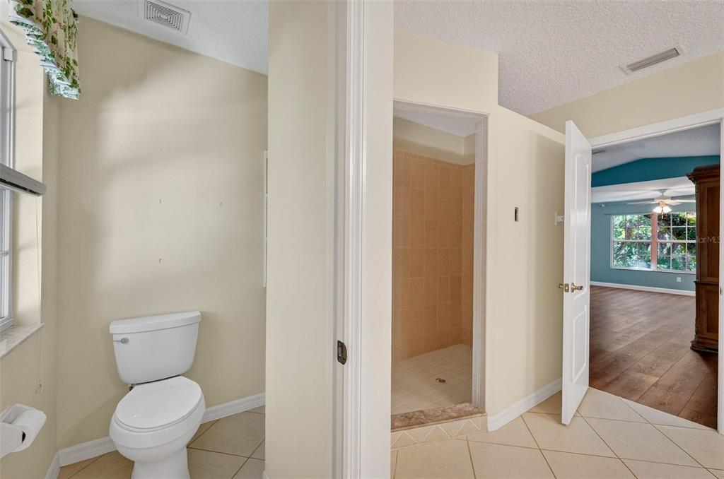4875 Sailfish Drive Ponce Inlet, FL 32127 - Photo 43 of 60 a bathroom with a toilet and a shower