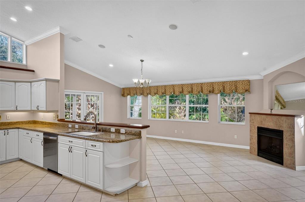4875 Sailfish Drive Ponce Inlet, FL 32127 - Photo 7 of 60 a kitchen with a sink cabinets and window