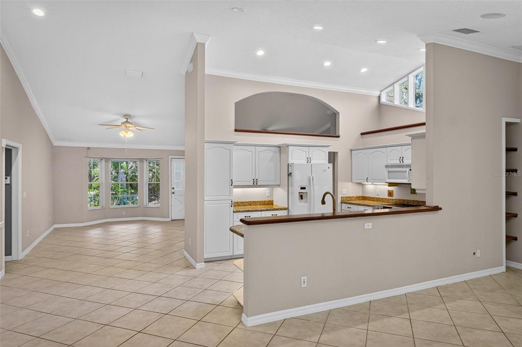 4875 Sailfish Drive Ponce Inlet, FL 32127 - Photo 9 of 60 a kitchen with stainless steel appliances granite countertop a sink and a stove