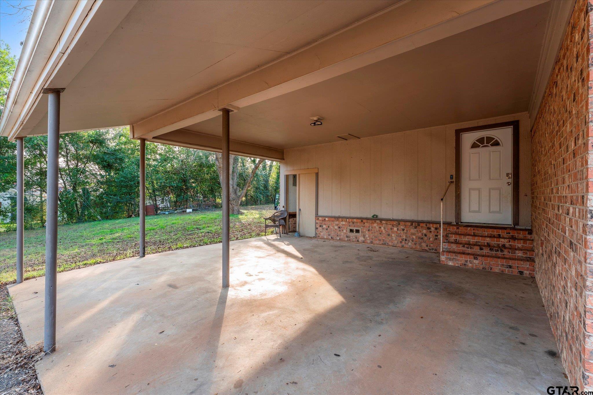 1108 Merritt Avenue Mount Pleasant, TX 75455 - Photo 5 of 17 a view of a backyard