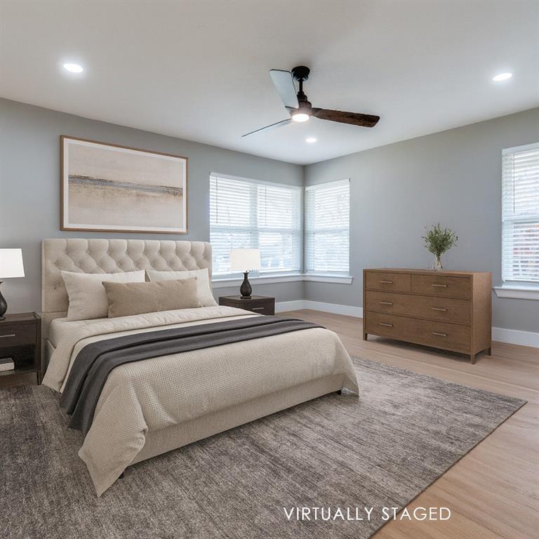 2542 Delmac Drive Dallas, TX 75233 - Photo 12 of 20 a spacious bedroom with a bed and window