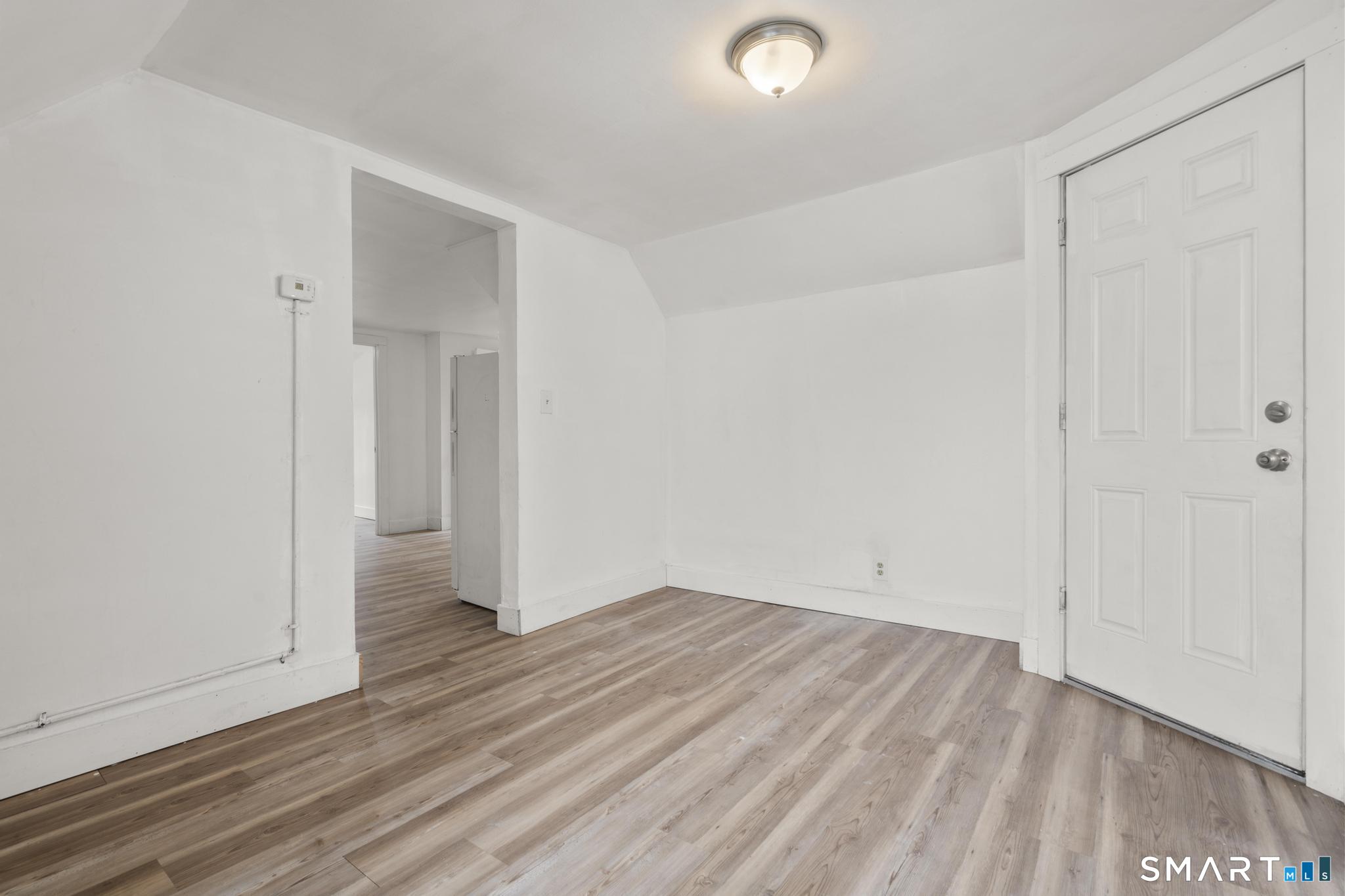 103 Walnut Street Waterbury, CT 06704 - Photo 17 of 38 wooden floor in an empty room