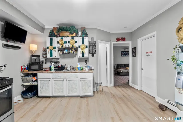 a kitchen with stainless steel appliances a microwave a stove and refrigerator