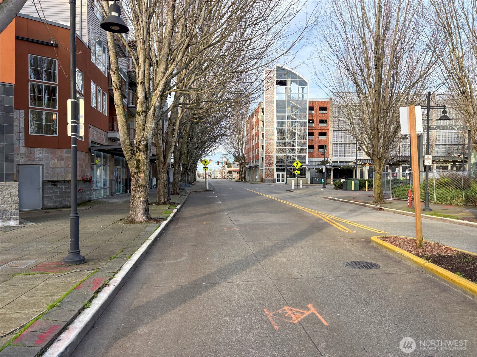 225 Logan Avenue South, Unit 111 Renton, WA 98057 - Photo 2 of 33 a building with trees in front of it