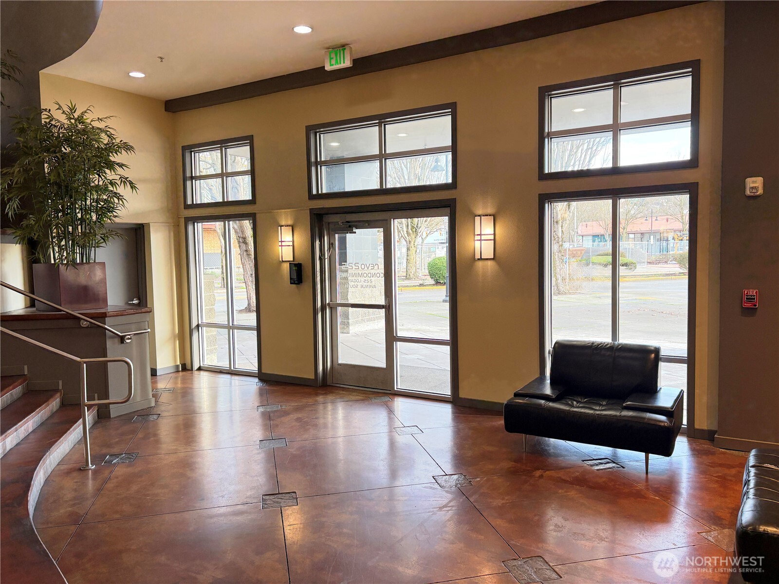 225 Logan Avenue South, Unit 111 Renton, WA 98057 - Photo 23 of 33 a living room with furniture and large windows
