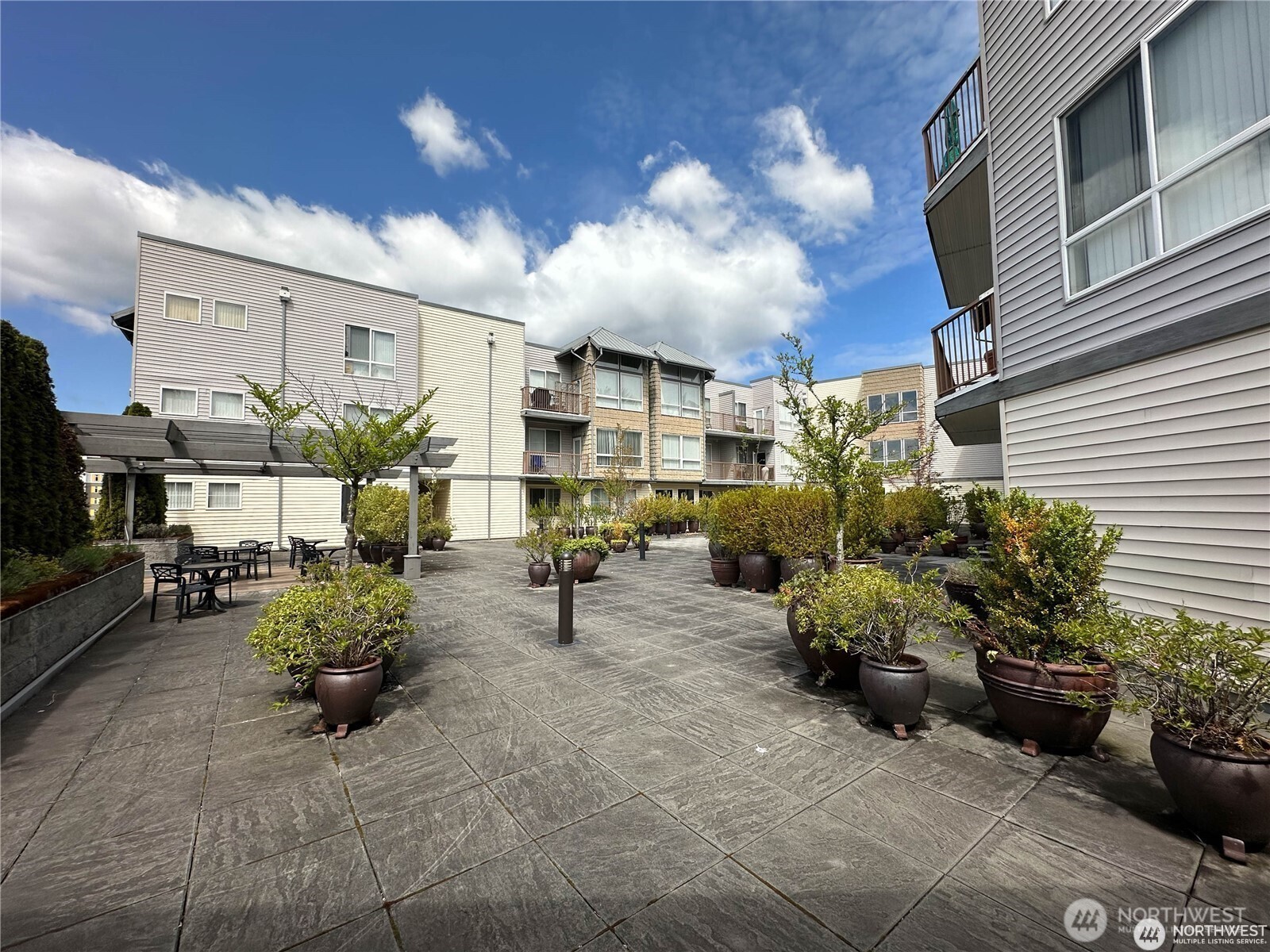 225 Logan Avenue South, Unit 111 Renton, WA 98057 - Photo 30 of 33 a view of a chairs and tables in the patio