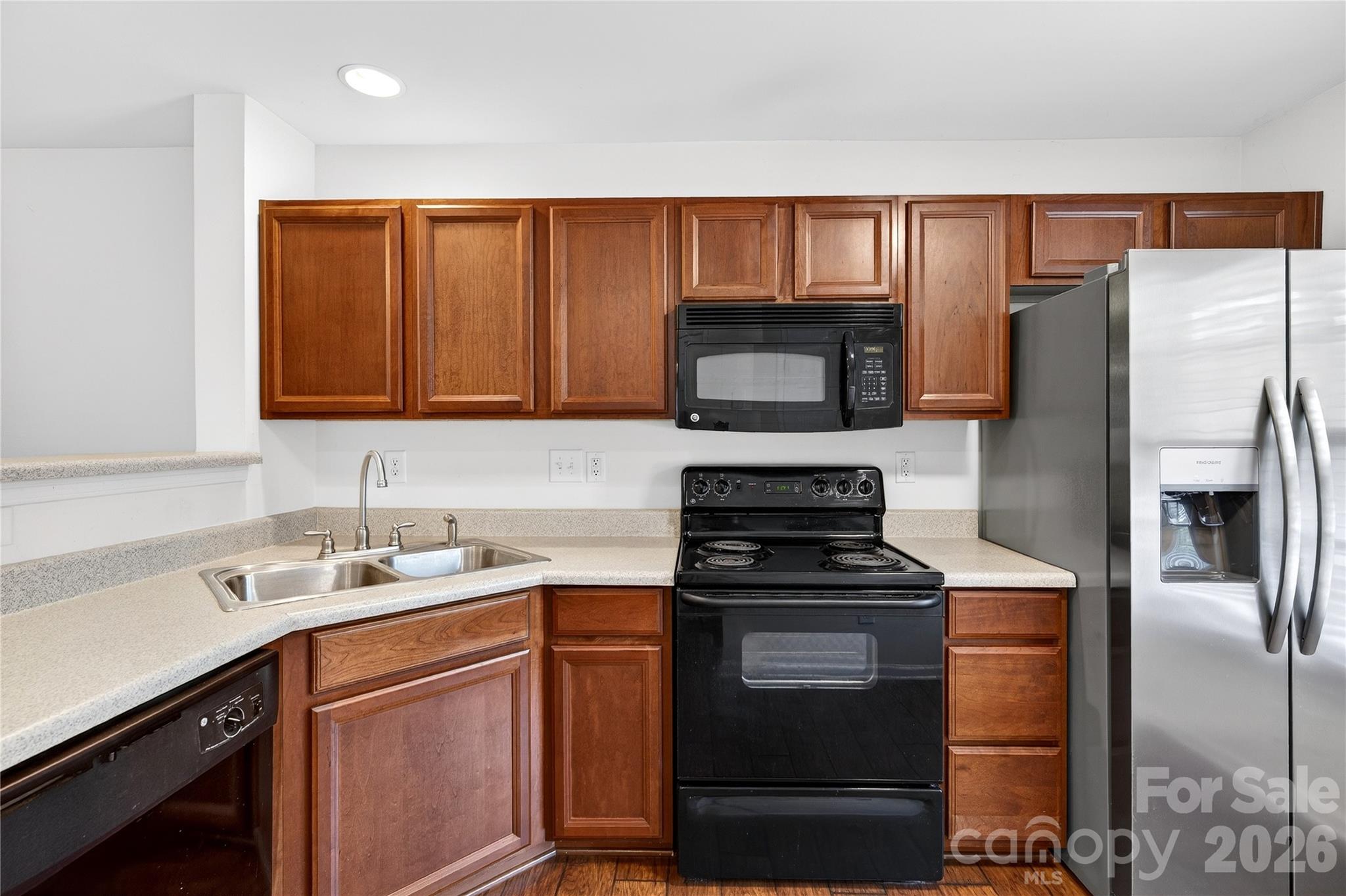149 Marakery Road, Unit C Mooresville, NC 28115 - Photo 11 of 45 a kitchen with a refrigerator sink and microwave