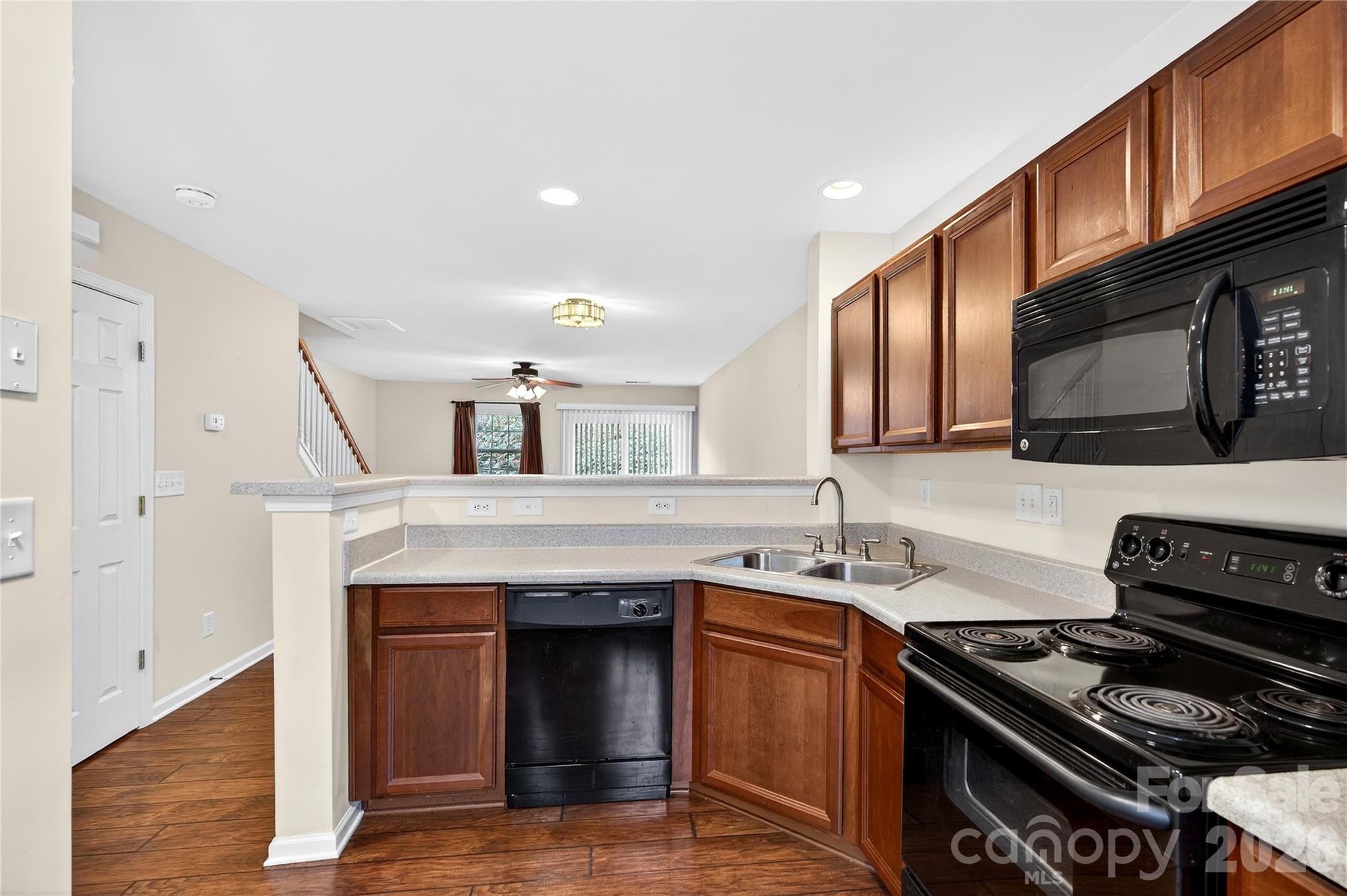 149 Marakery Road, Unit C Mooresville, NC 28115 - Photo 13 of 45 a kitchen with stainless steel appliances granite countertop a stove and a sink