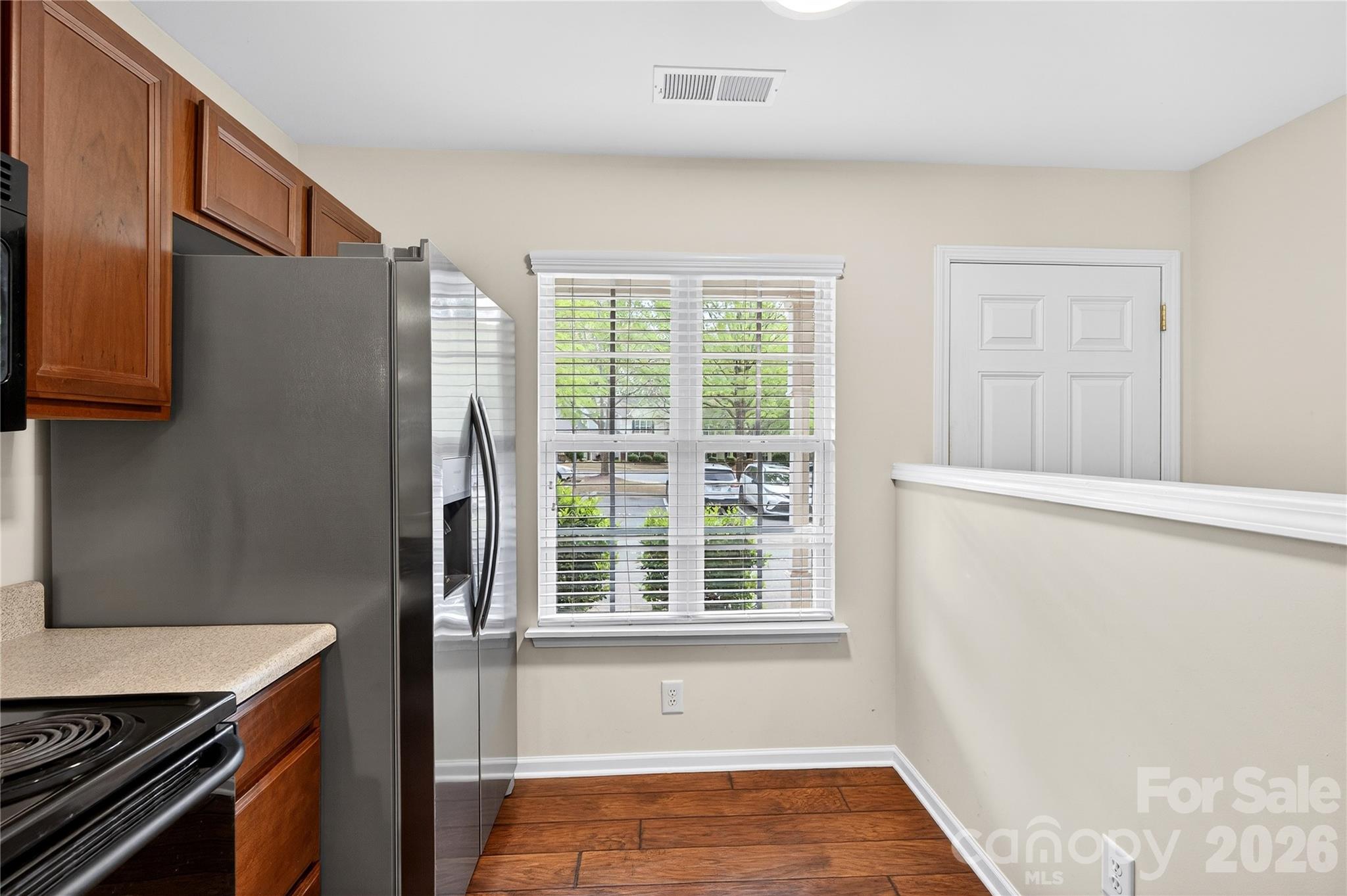 149 Marakery Road, Unit C Mooresville, NC 28115 - Photo 14 of 45 a view of a kitchen with wooden floor and a window