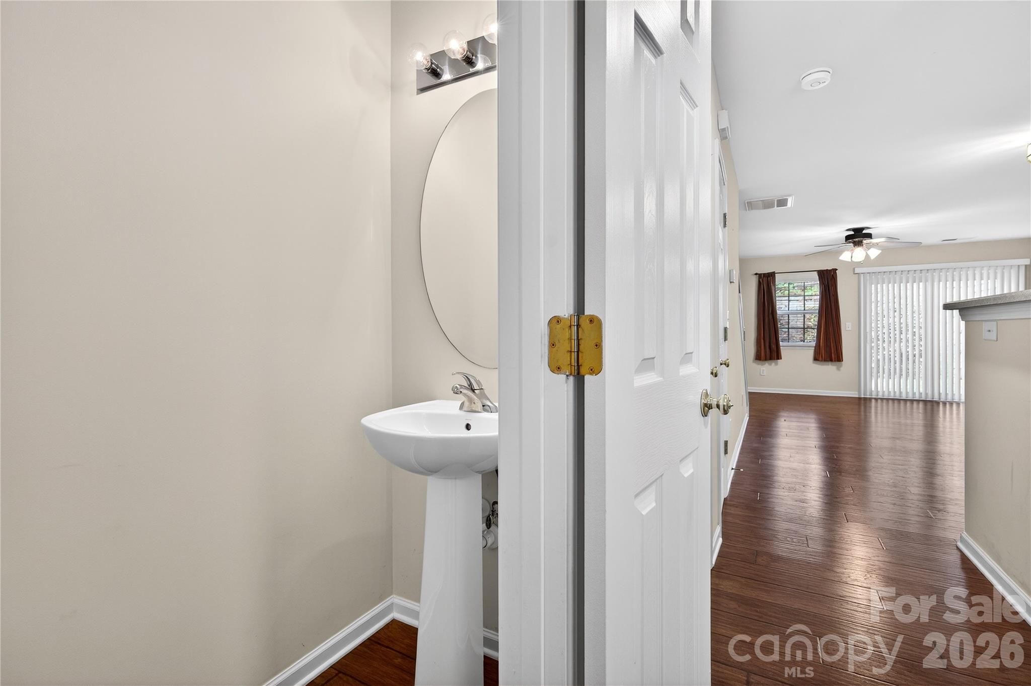 149 Marakery Road, Unit C Mooresville, NC 28115 - Photo 16 of 45 a view of a hallway with wooden floor and staircase
