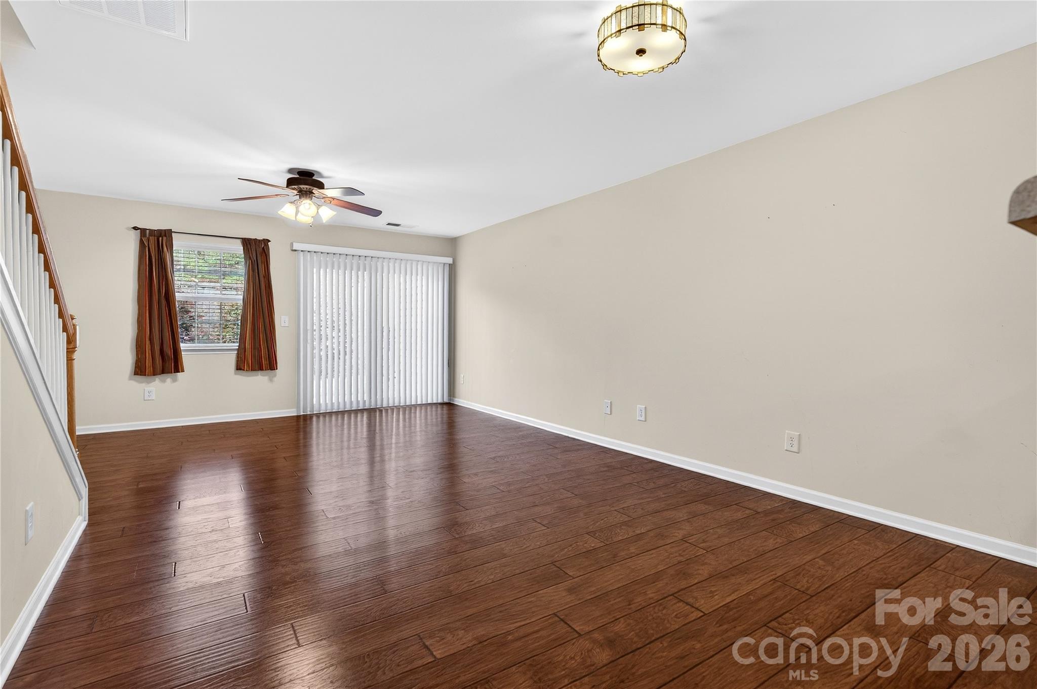149 Marakery Road, Unit C Mooresville, NC 28115 - Photo 17 of 45 a view of livingroom with hardwood floor and kitchen view