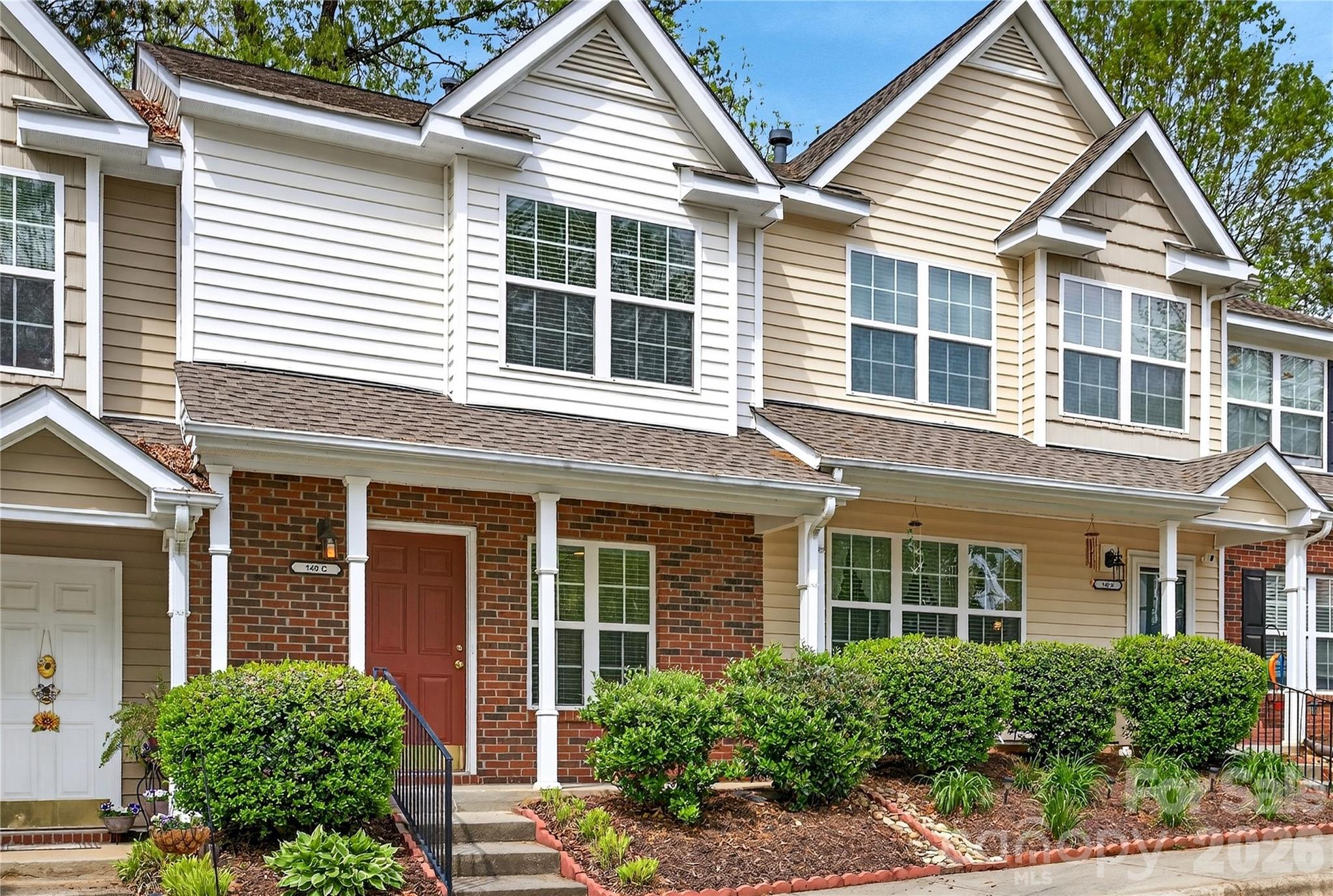 149 Marakery Road, Unit C Mooresville, NC 28115 - Photo 2 of 45 front view of a brick house with a large windows