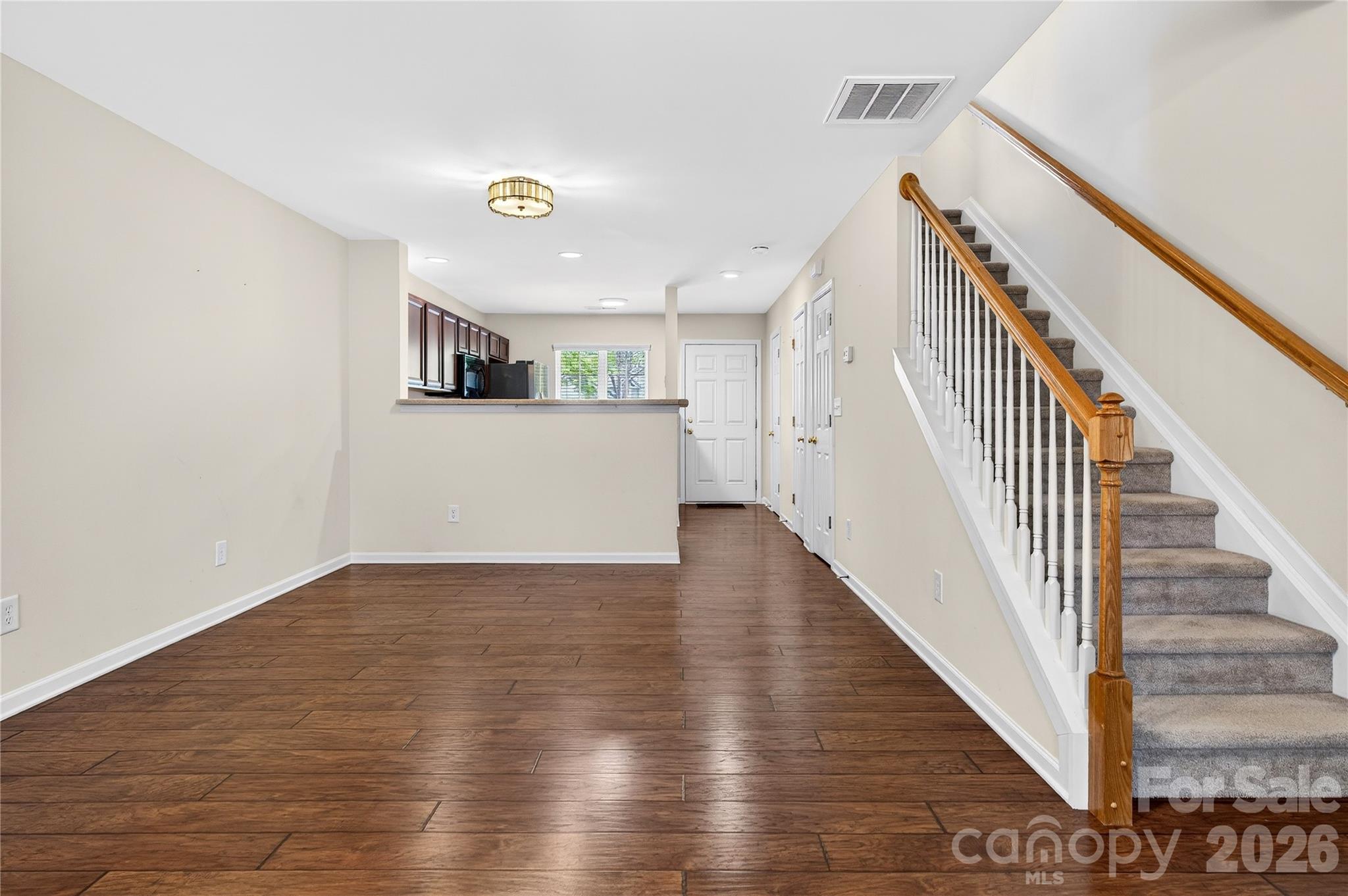 149 Marakery Road, Unit C Mooresville, NC 28115 - Photo 21 of 45 a view of a hallway with wooden floor and staircase