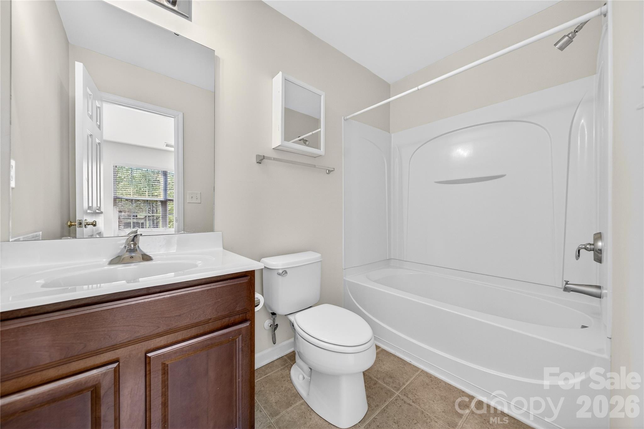 149 Marakery Road, Unit C Mooresville, NC 28115 - Photo 24 of 45 a bathroom with a sink a toilet and a bathtub
