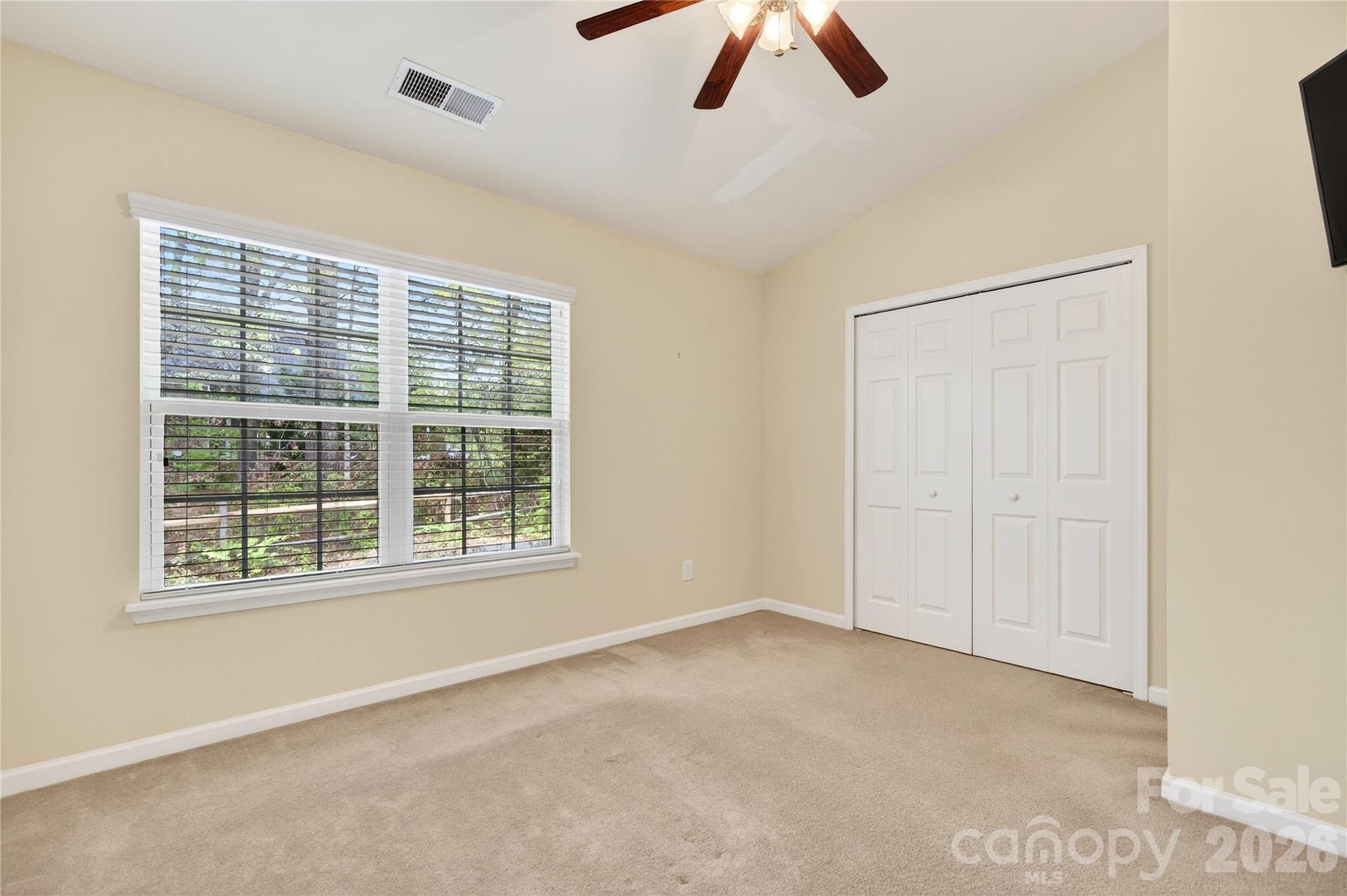 149 Marakery Road, Unit C Mooresville, NC 28115 - Photo 29 of 45 an empty room with ceiling fan and window