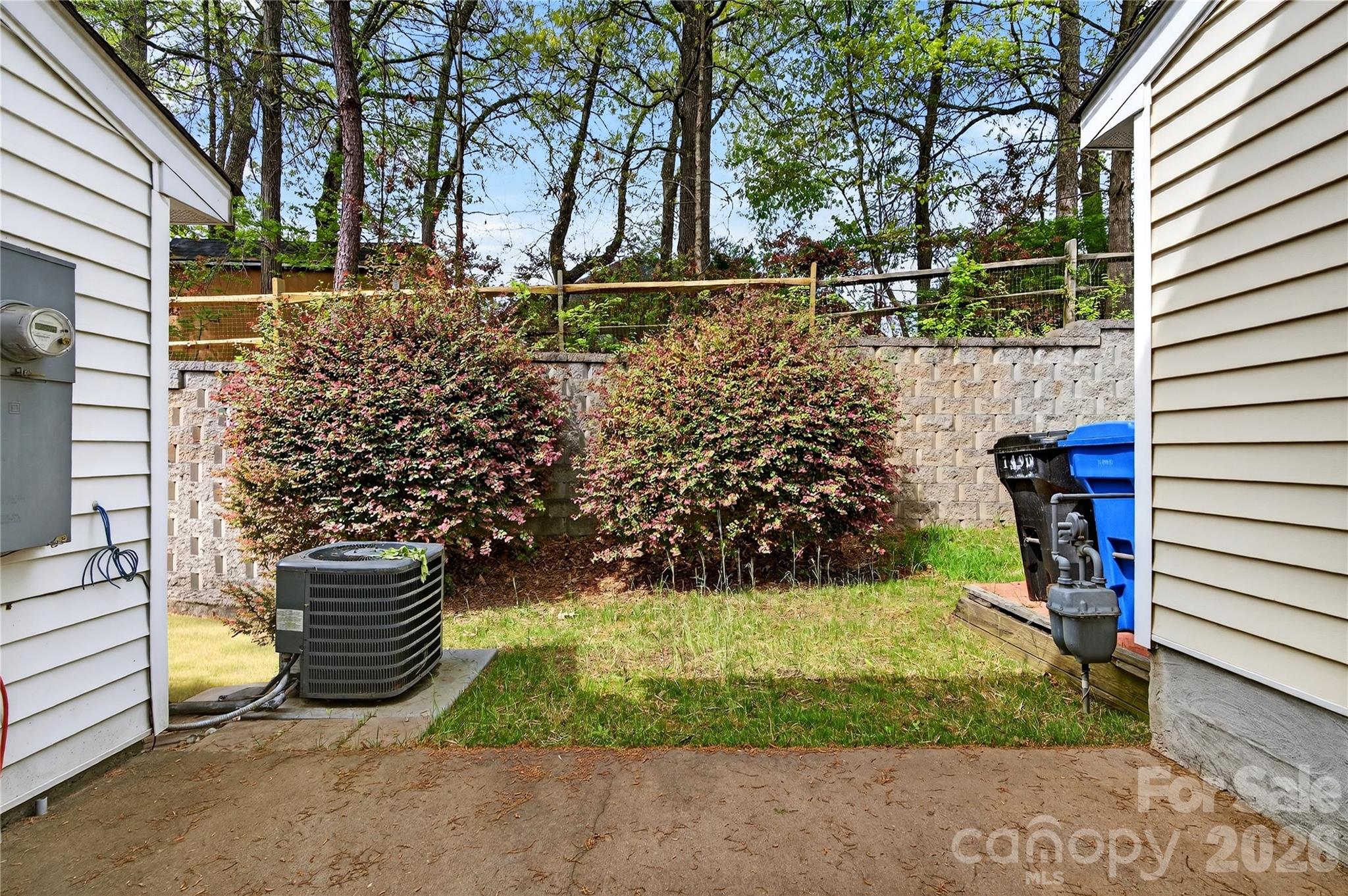 149 Marakery Road, Unit C Mooresville, NC 28115 - Photo 7 of 45 a view of a back yard of the house and a chair