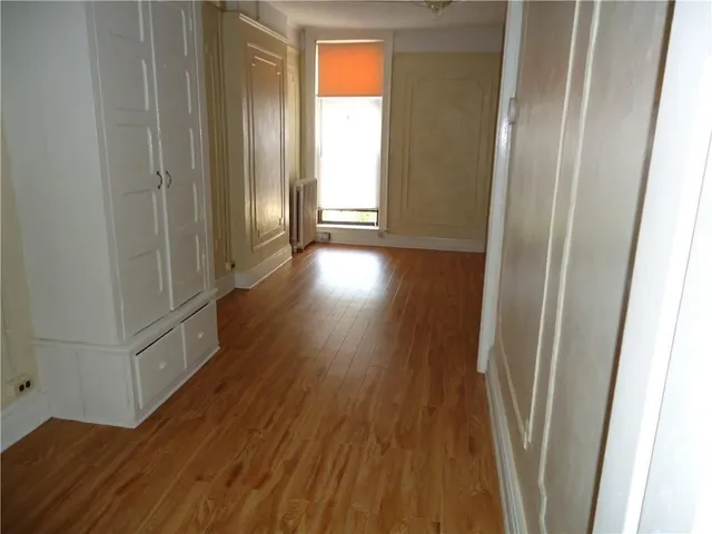 a view of entryway with wooden floor