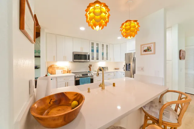 a kitchen with stainless steel appliances granite countertop a sink and cabinets