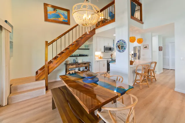 a view of dining room and hall with wooden floor