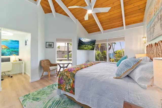 a bed room with a bed and a chair