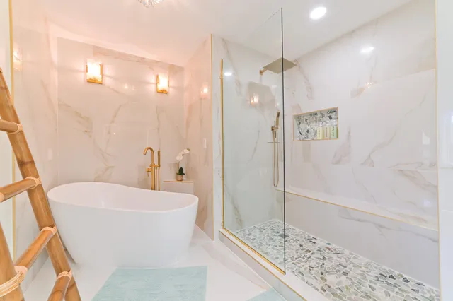 a bathroom with a bathtub and a shower