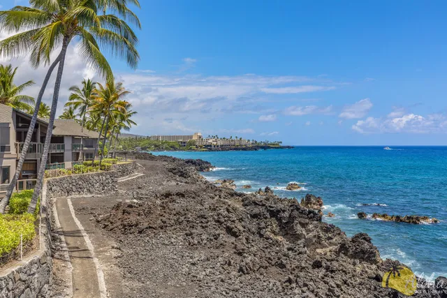 a view of a lake with a yard