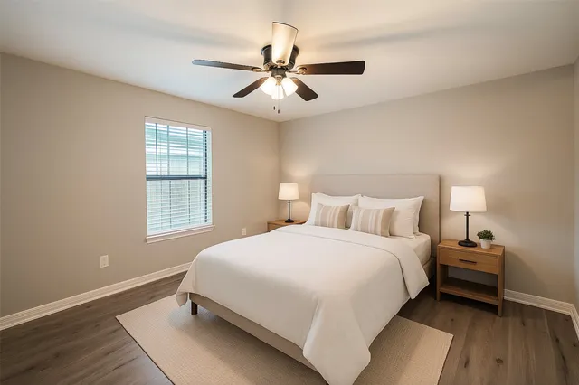 a bedroom with a bed and window