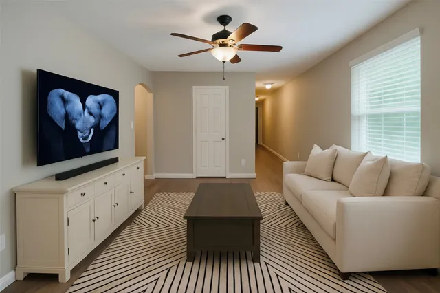 a living room with furniture and a rug