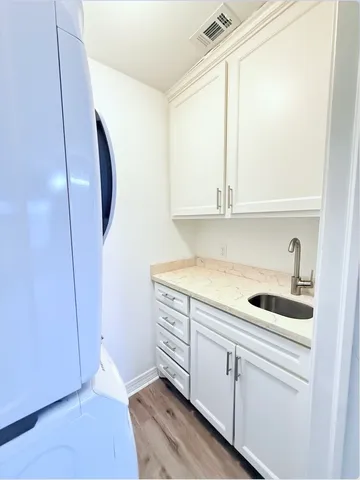 a kitchen with a sink and cabinets