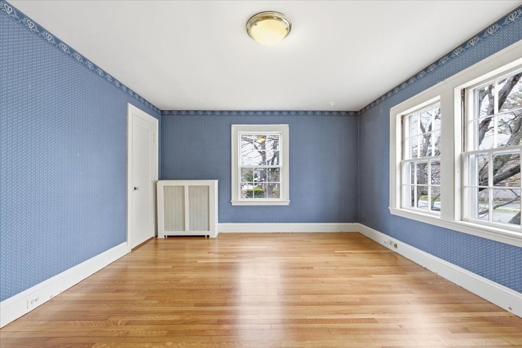 238 Harris Avenue Needham, MA 02492 - Photo 27 of 35 a view of an empty room with a window and wooden floor