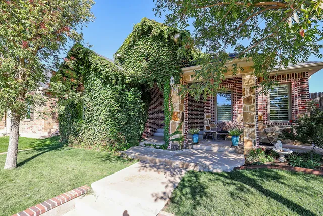 a backyard of a house with outdoor seating