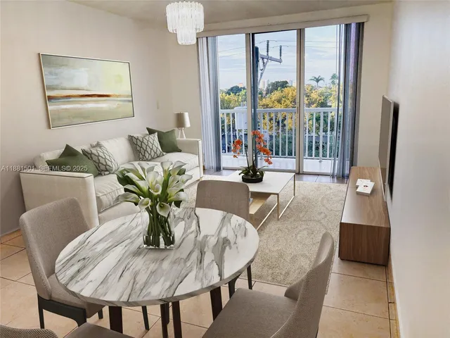 a dining room with furniture and large windows