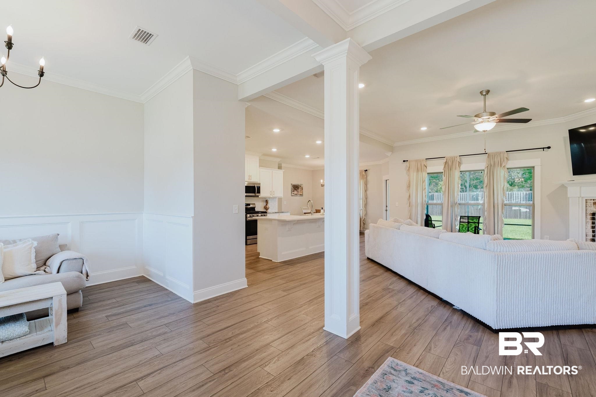 7872 Calverton Street Foley, AL 36535 - Photo 29 of 76 Open-concept living area featuring wood-finish flooring, recessed lighting, and crown molding