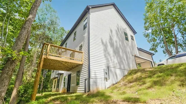a view of a house with a tree
