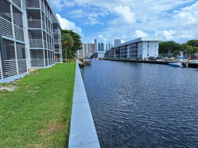 a view of a house with swimming pool and sitting area