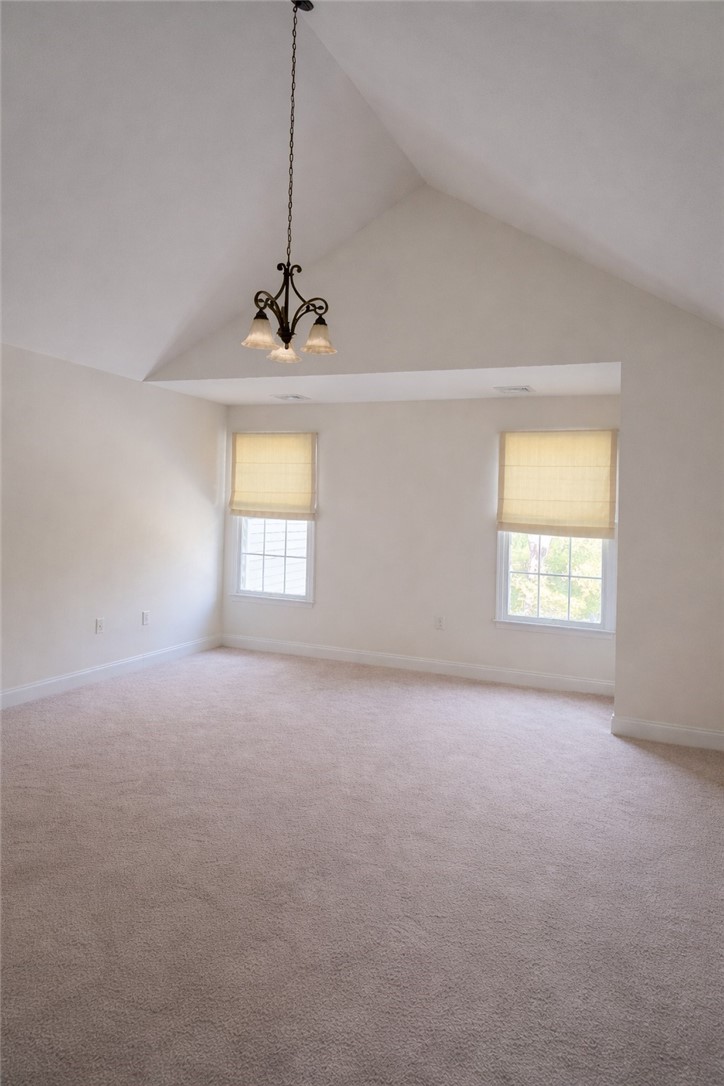 419 Albion Road, Unit 10 Lincoln, RI 02865 - Photo 16 of 17 Double dramatic doors open to the impressive primary suite with soaring cathedral/vaulted ceilings.
