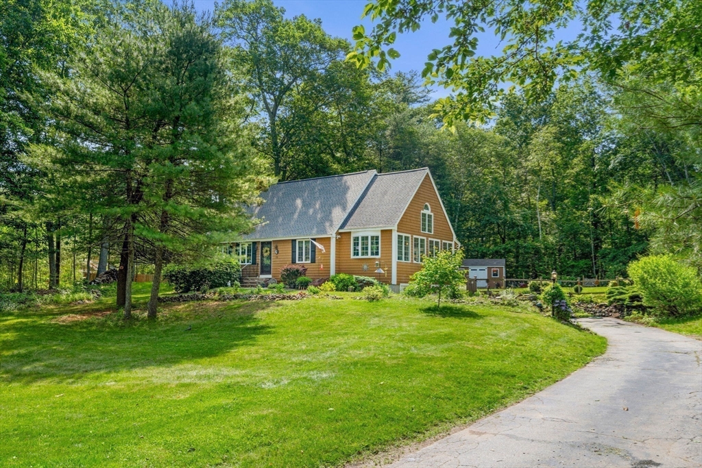 115 Depot Road Boxford, MA 01921 - Photo 1 of 40 a front view of a house with a yard