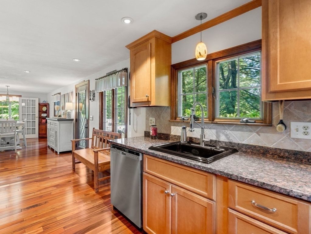 115 Depot Road Boxford, MA 01921 - Photo 15 of 40 a kitchen with stainless steel appliances granite countertop a sink a counter space and wooden floor