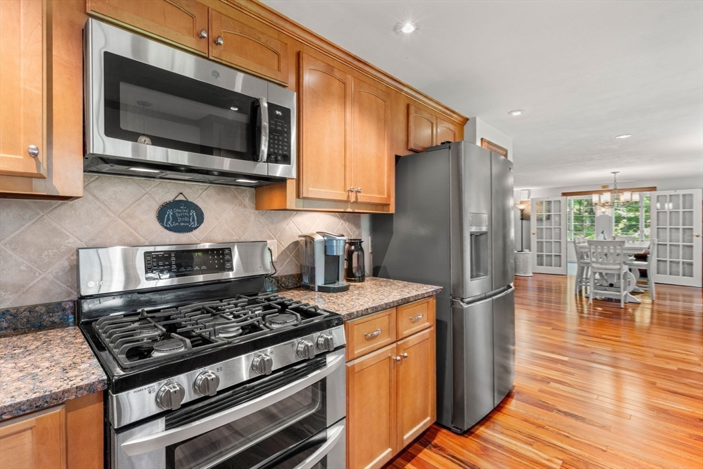 115 Depot Road Boxford, MA 01921 - Photo 16 of 40 a kitchen with a stove and a microwave