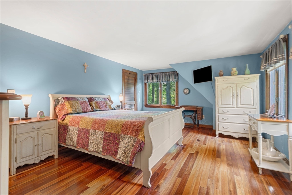 115 Depot Road Boxford, MA 01921 - Photo 18 of 40 a spacious bedroom with a bed and a cabinets