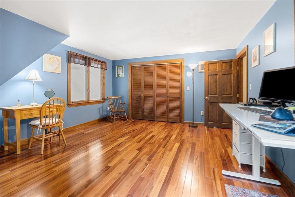 115 Depot Road Boxford, MA 01921 - Photo 20 of 40 a bedroom with a bed and large windows