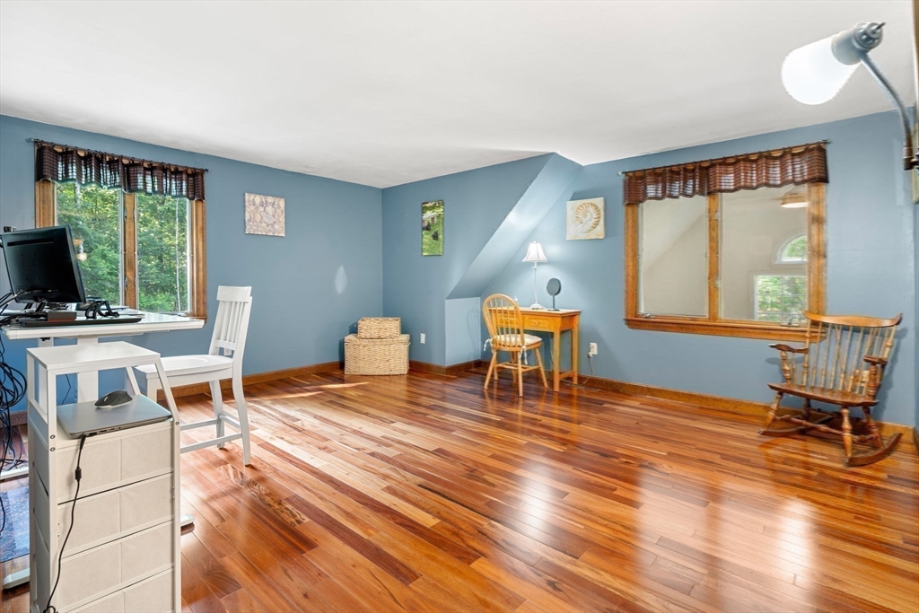 115 Depot Road Boxford, MA 01921 - Photo 21 of 40 a living room with furniture a piano and a floor to ceiling window