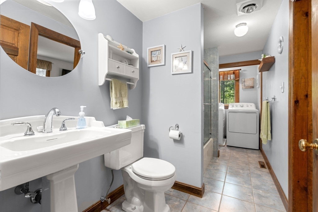 115 Depot Road Boxford, MA 01921 - Photo 23 of 40 a bathroom with a toilet sink and mirror